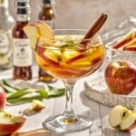 Apple Pie Sangria is a light, refreshing, and delicious Caramel Apple Sangria that’s perfect for any fall gathering. This easy recipe is always a hit at parties! Made with apple cider, caramel vodka, white wine, ginger ale, and more, we like to call it Thanksgiving Sangria because it captures the essence of autumn in a glass. While we have sangria recipes for every occasion, this one is our favorite!